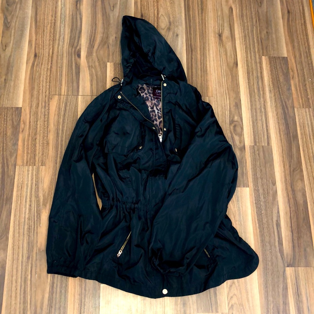 Women’s black windbreaker.